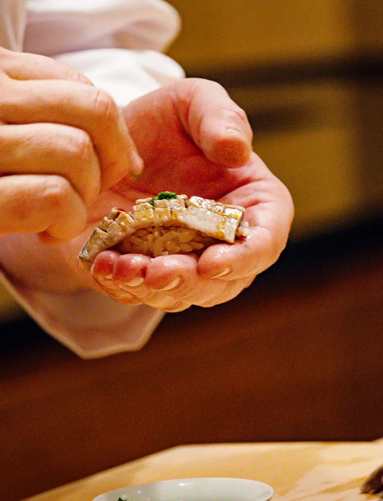Chef handcrafting nigiri sushi at Miura Beverly Hills, continuing the legacy of Japanese fine dining in Los Angeles